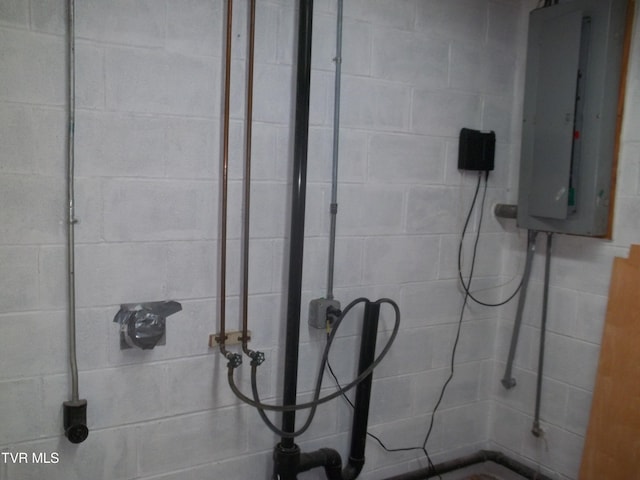 313 Milburn Ave, Kingsport, TN 37660 - bathroom featuring electric panel, a tile shower, and concrete block wall