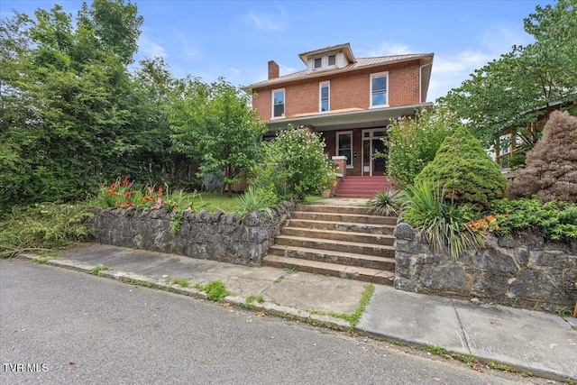 909 Highland Ave, Bristol, VA 24201 - american foursquare style home with brick siding, covered porch, and stairway
