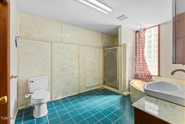 909 Highland Ave, Bristol, VA 24201 - bathroom with vanity, a stall shower, and tile patterned flooring