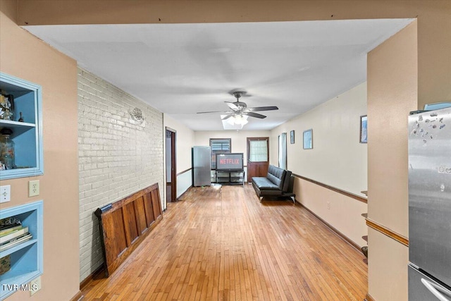 909 Highland Ave, Bristol, VA 24201 - hall featuring light wood-type flooring and brick wall