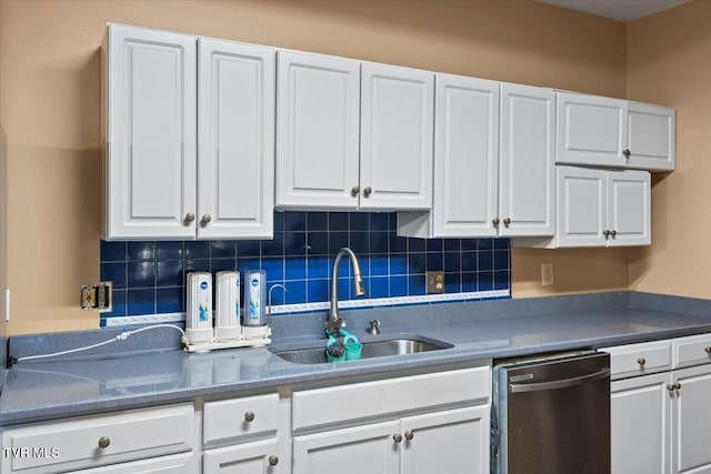 909 Highland Ave, Bristol, VA 24201 - kitchen featuring stainless steel dishwasher, white cabinetry, decorative backsplash, and dark countertops