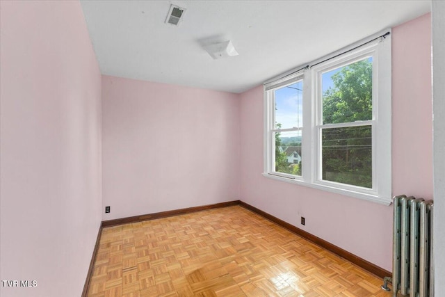 909 Highland Ave, Bristol, VA 24201 - empty room featuring radiator heating unit and baseboards