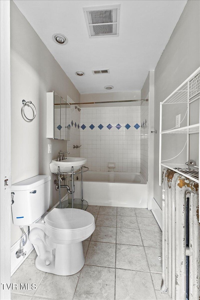 909 Highland Ave, Bristol, VA 24201 - full bath with radiator heating unit, shower / bath combination, and tile patterned floors