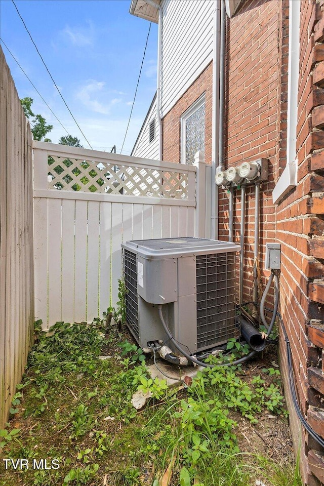 909 Highland Ave, Bristol, VA 24201 - exterior view of a central air condition unit and brick siding