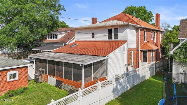 909 Highland Ave, Bristol, VA 24201 - back of property featuring a sunroom, a chimney, and a fenced backyard