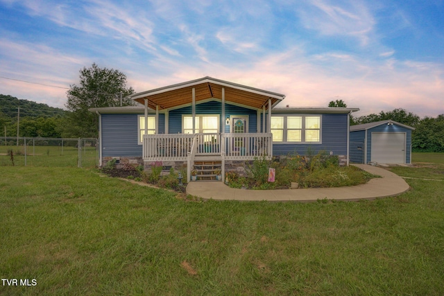 715 Dunham Rd, Chuckey, TN 37641 - view of front facade featuring an outbuilding, a garage, and a porch