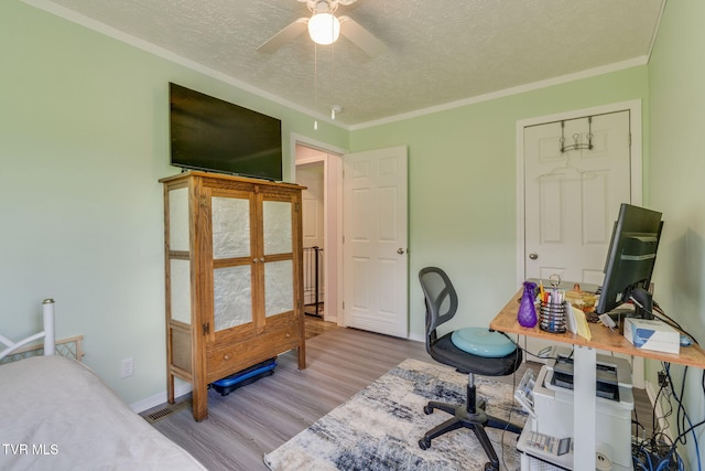 715 Dunham Rd, Chuckey, TN 37641 - office featuring a textured ceiling, wood finished floors, a ceiling fan, and ornamental molding