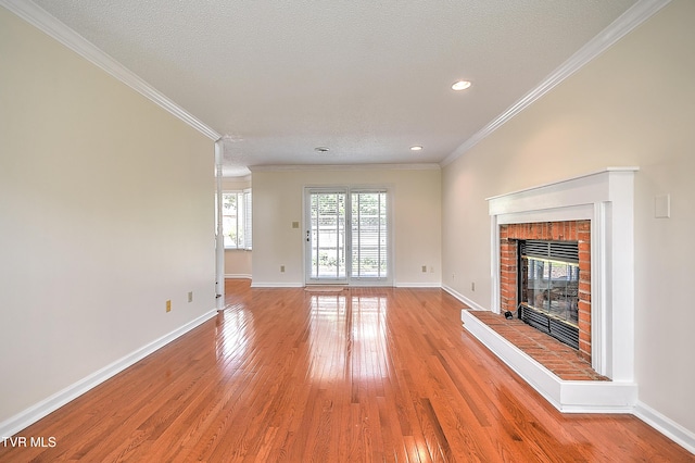 226 Willowbend Ct, Kingsport, TN 37660 - unfurnished living room with a fireplace, light wood-style flooring, ornamental molding, and recessed lighting