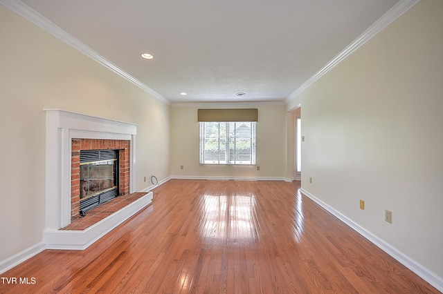 226 Willowbend Ct, Kingsport, TN 37660 - unfurnished living room featuring light wood-style floors, a brick fireplace, recessed lighting, and ornamental molding