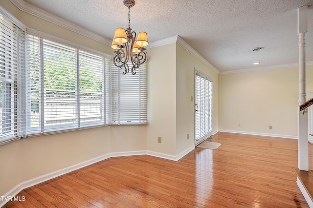 226 Willowbend Ct, Kingsport, TN 37660 - unfurnished dining area featuring light wood finished floors, ornamental molding, a textured ceiling, a chandelier, and recessed lighting