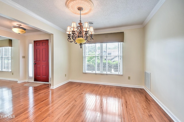 226 Willowbend Ct, Kingsport, TN 37660 - entrance foyer featuring light wood-style floors, a chandelier, a textured ceiling, and crown molding