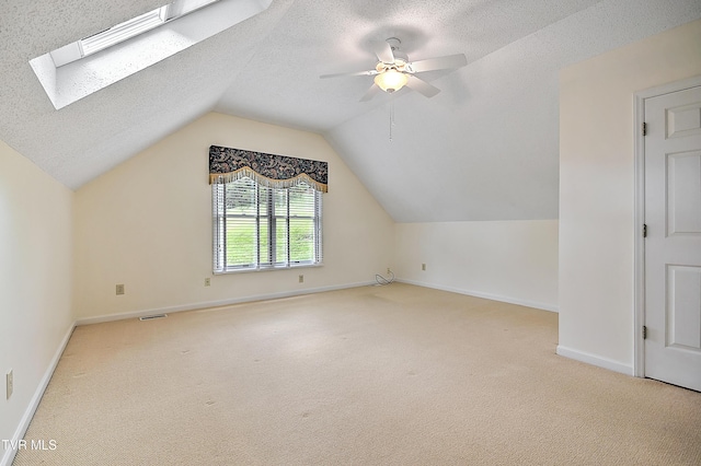 226 Willowbend Ct, Kingsport, TN 37660 - bonus room with carpet, lofted ceiling, ceiling fan, a textured ceiling, and a skylight