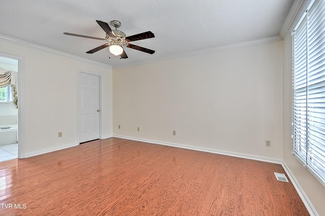 226 Willowbend Ct, Kingsport, TN 37660 - empty room with light wood-style flooring, ceiling fan, crown molding, and a textured ceiling