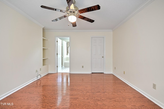 226 Willowbend Ct, Kingsport, TN 37660 - unfurnished room featuring ornamental molding, a ceiling fan, built in shelves, wood finished floors, and a textured ceiling
