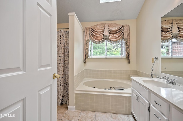 226 Willowbend Ct, Kingsport, TN 37660 - bathroom featuring vanity, a jetted tub, tile patterned flooring, and a skylight