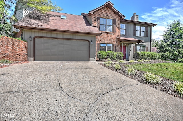 226 Willowbend Ct, Kingsport, TN 37660 - view of front of house featuring a chimney, an attached garage, concrete driveway, and brick siding