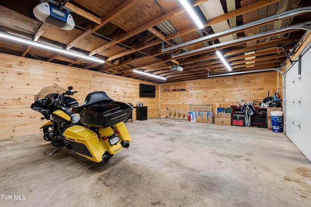 1524 Redwood Dr, Kingsport, TN 37664 - garage featuring a garage door opener and wood walls