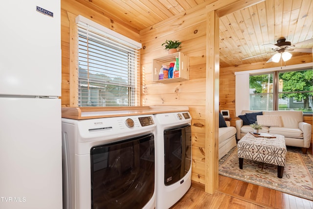 1524 Redwood Dr, Kingsport, TN 37664 - laundry area with light wood-style floors, ceiling fan, wood walls, wood ceiling, and washer and dryer