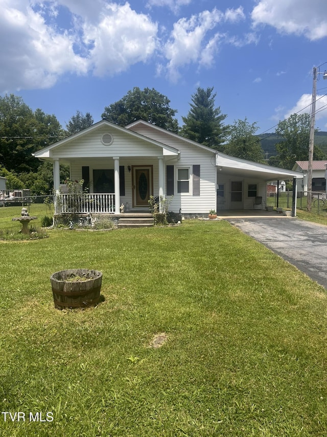 119 Liberty Hollow Rd, Elizabethton, TN 37643 - view of front facade featuring covered porch, asphalt driveway, a carport, and a front yard