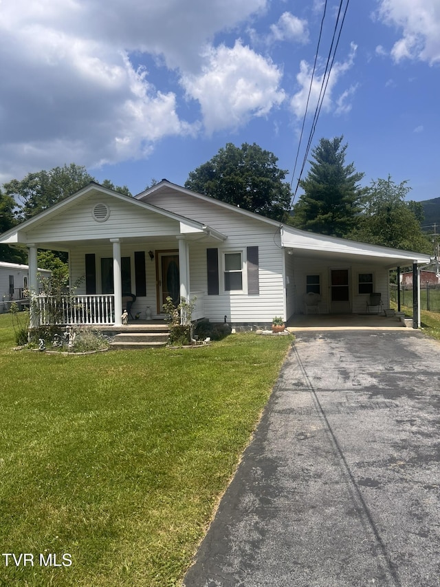 119 Liberty Hollow Rd, Elizabethton, TN 37643 - view of front of house with covered porch, a front lawn, asphalt driveway, and an attached carport