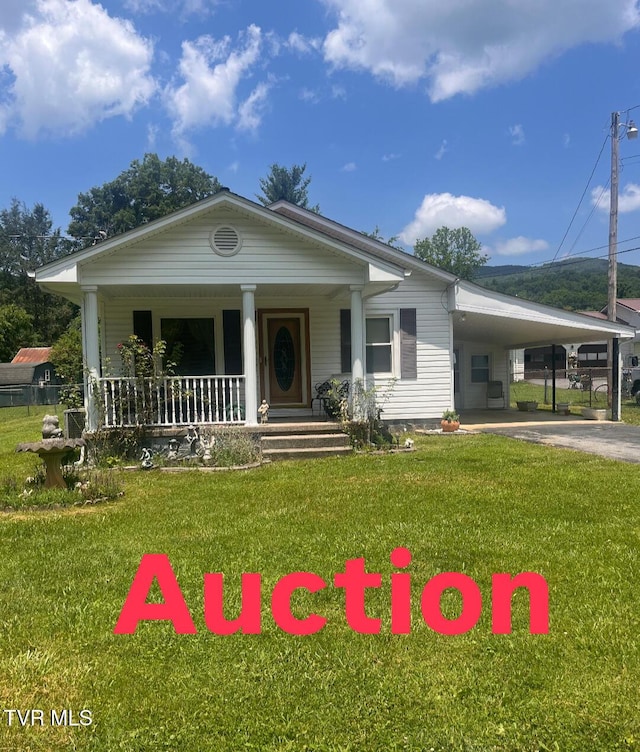 119 Liberty Hollow Rd, Elizabethton, TN 37643 - view of front facade with covered porch, driveway, a carport, and a front lawn