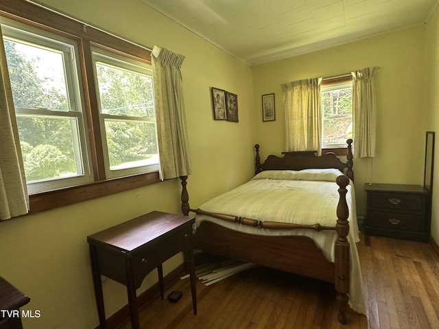 2065 Coeburn Rd, Clintwood, VA 24228 - bedroom featuring dark wood-type flooring and ornamental molding