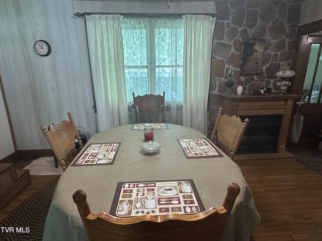 2065 Coeburn Rd, Clintwood, VA 24228 - dining room with wood finished floors and a fireplace