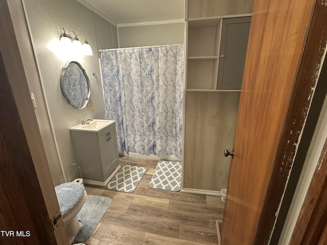 2065 Coeburn Rd, Clintwood, VA 24228 - bathroom featuring vanity, wood finished floors, ornamental molding, and a shower with curtain