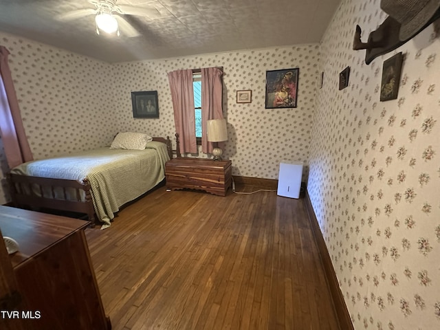 2065 Coeburn Rd, Clintwood, VA 24228 - bedroom with wallpapered walls, wood-type flooring, and ceiling fan