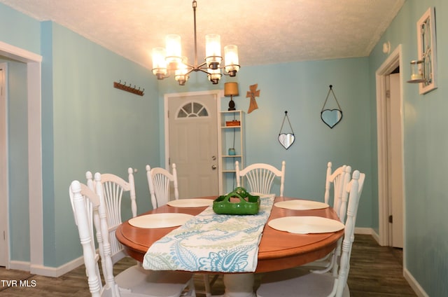 2165 Steadman St, Kingsport, TN 37664 - dining area featuring wood finished floors, a chandelier, and a textured ceiling
