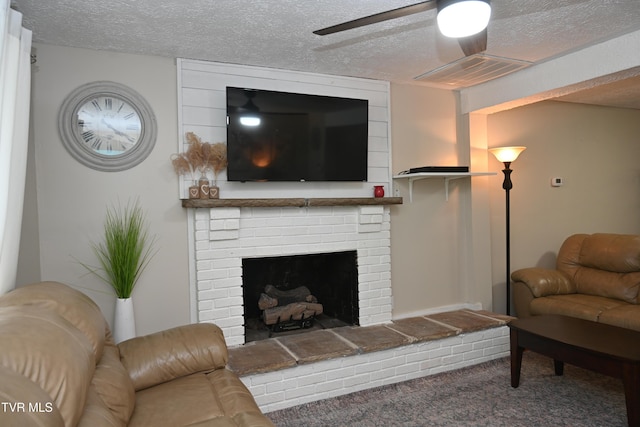 2165 Steadman St, Kingsport, TN 37664 - living room featuring a textured ceiling, ceiling fan, a brick fireplace, and carpet flooring