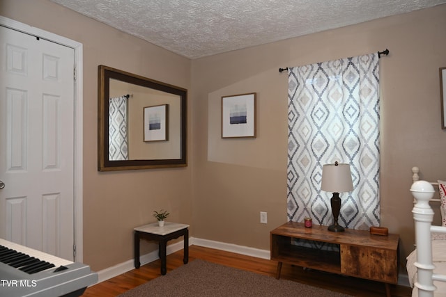 2165 Steadman St, Kingsport, TN 37664 - corridor with wood finished floors and a textured ceiling