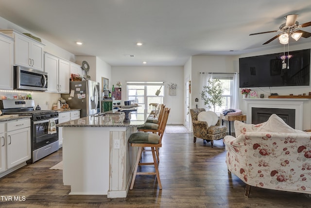 5402 Wildlife Cir, Piney Flats, TN 37686 - kitchen with appliances with stainless steel finishes, plenty of natural light, open floor plan, white cabinetry, and recessed lighting
