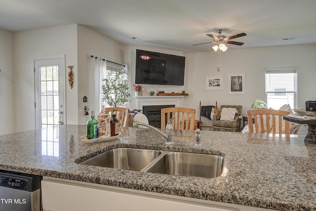 5402 Wildlife Cir, Piney Flats, TN 37686 - kitchen featuring open floor plan, healthy amount of natural light, stone countertops, and stainless steel dishwasher
