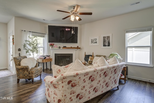 5402 Wildlife Cir, Piney Flats, TN 37686 - living room with dark wood-type flooring, a glass covered fireplace, and ceiling fan