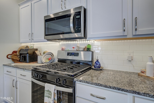 5402 Wildlife Cir, Piney Flats, TN 37686 - kitchen featuring appliances with stainless steel finishes, tasteful backsplash, white cabinets, and stone counters