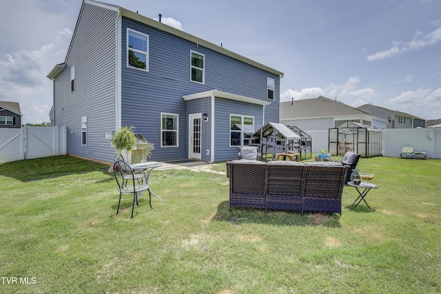 5402 Wildlife Cir, Piney Flats, TN 37686 - back of house featuring a gate, a fenced backyard, an outdoor living space, a patio, and an exterior structure