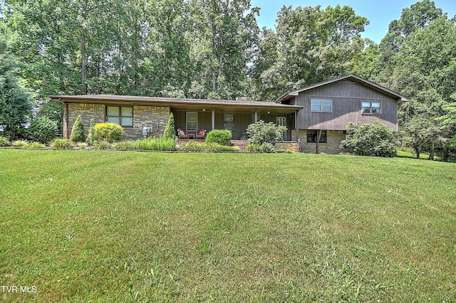 4700 Weaver Pike, Bluff City, TN 37618 - split level home featuring a front lawn, brick siding, and covered porch