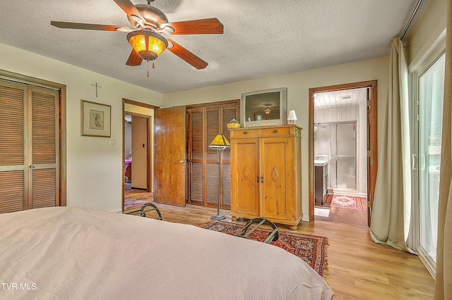 4700 Weaver Pike, Bluff City, TN 37618 - bedroom with light wood-type flooring, a textured ceiling, multiple closets, and a ceiling fan