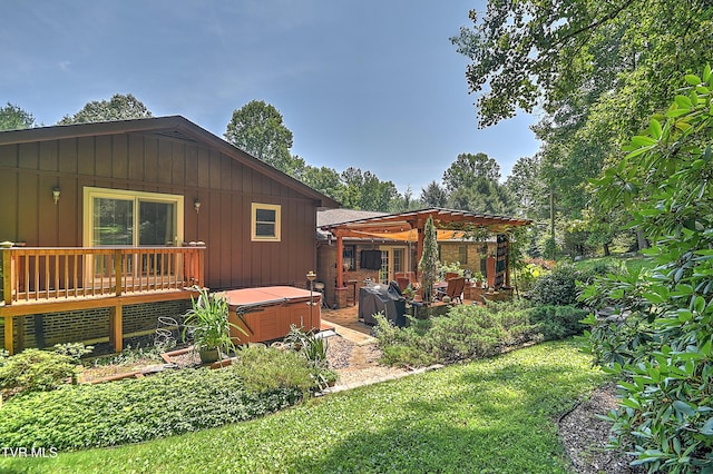 4700 Weaver Pike, Bluff City, TN 37618 - rear view of house featuring a hot tub, a pergola, board and batten siding, and a yard