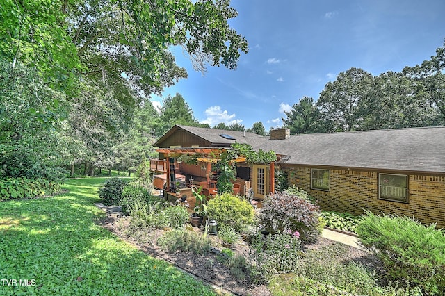 4700 Weaver Pike, Bluff City, TN 37618 - view of front facade featuring a front lawn, a chimney, brick siding, and roof with shingles