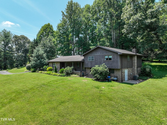 4700 Weaver Pike, Bluff City, TN 37618 - view of front facade with a chimney, a front lawn, and brick siding