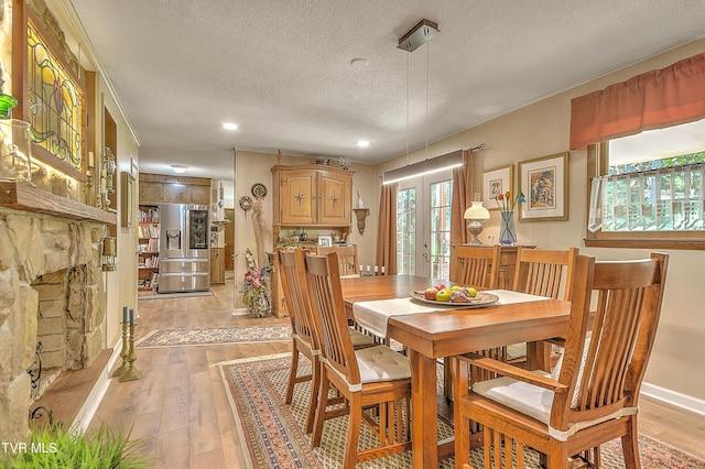 4700 Weaver Pike, Bluff City, TN 37618 - dining room with a textured ceiling, light wood-type flooring, french doors, and recessed lighting