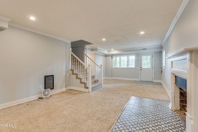 1121 Watauga St, Kingsport, TN 37660 - carpeted entrance foyer featuring a fireplace with flush hearth, stairway, ornamental molding, and recessed lighting