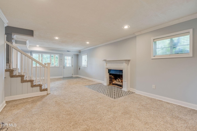 1121 Watauga St, Kingsport, TN 37660 - unfurnished living room featuring ornamental molding, carpet, recessed lighting, stairs, and a fireplace with flush hearth