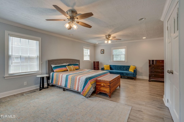 1121 Watauga St, Kingsport, TN 37660 - bedroom featuring a textured ceiling, wood finished floors, ornamental molding, a ceiling fan, and recessed lighting