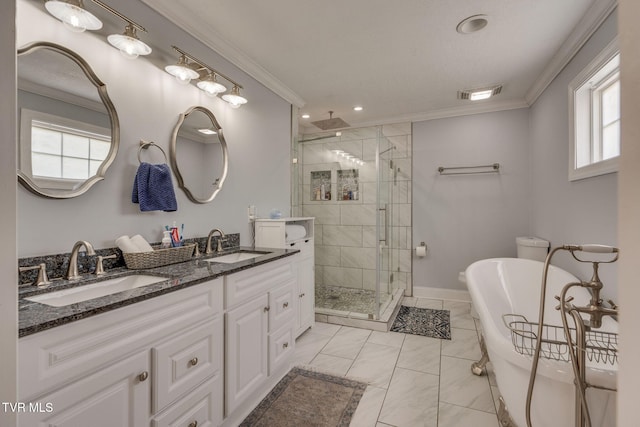 1121 Watauga St, Kingsport, TN 37660 - full bath with a stall shower, double vanity, ornamental molding, a soaking tub, and recessed lighting