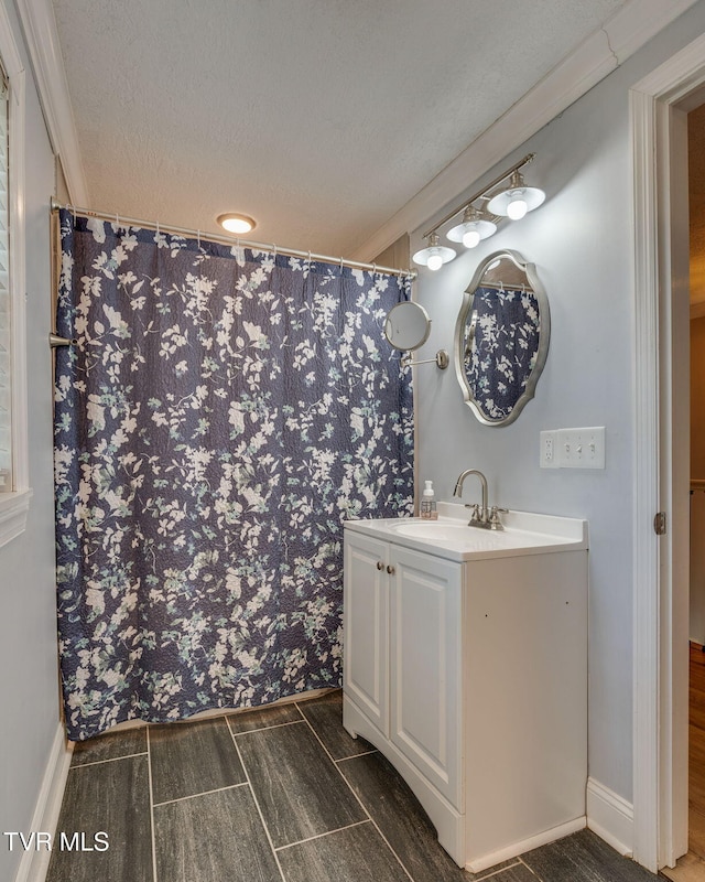 1121 Watauga St, Kingsport, TN 37660 - bathroom featuring vanity, a textured ceiling, crown molding, curtained shower, and wood finish floors