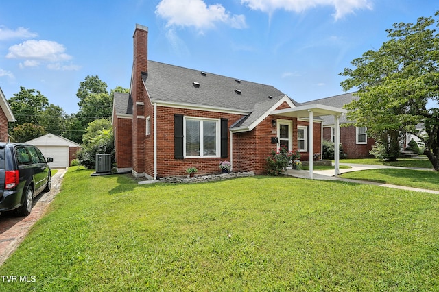 1340 Wateree St, Kingsport, TN 37660 - view of front facade featuring brick siding, a chimney, roof with shingles, and a front yard