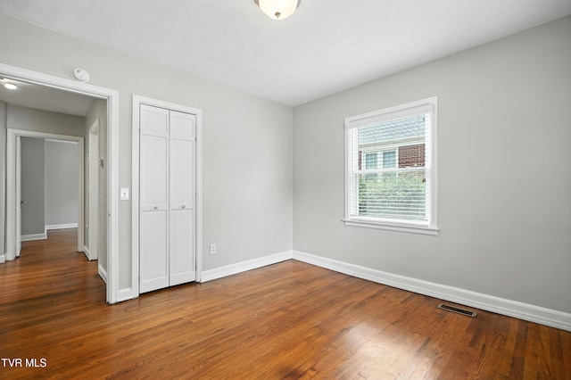 1340 Wateree St, Kingsport, TN 37660 - unfurnished bedroom with wood finished floors and a closet